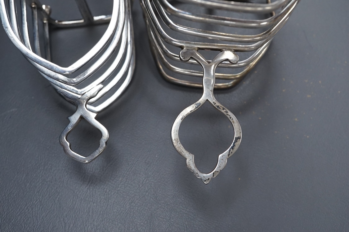 An Edwardian silver seven bar toast rack, by Mappin & Webb, Sheffield, 1902, 15.7cm, together with a George V smaller five bar toast rack, Thomas Bradbury & Sons, Sheffield, 1920, 15.6oz.